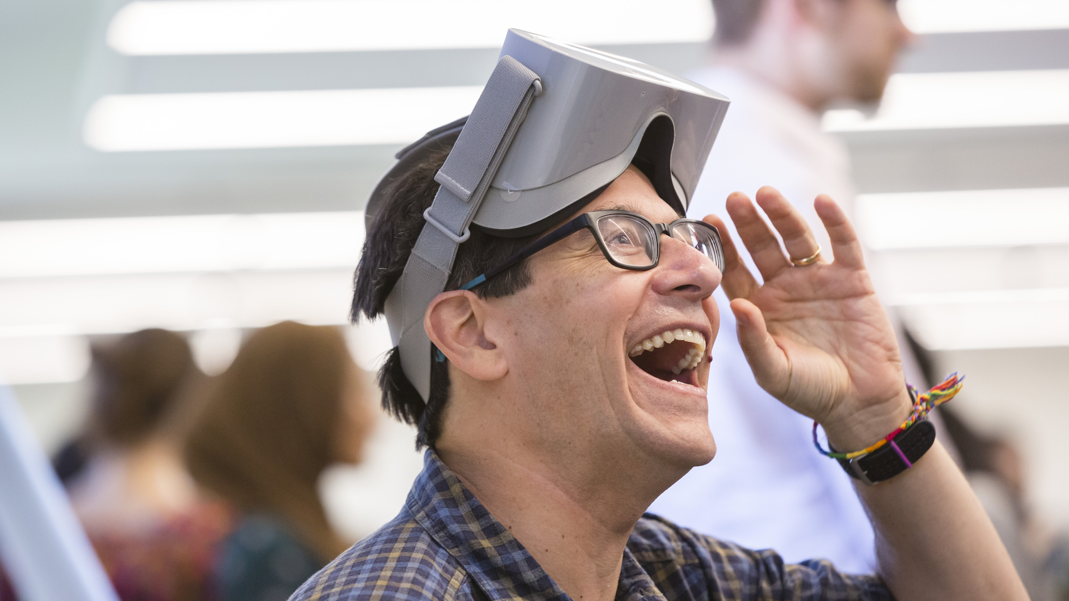 Professor Jeff Lidz, laughing out loud as he takes off a pair of VR Goggles