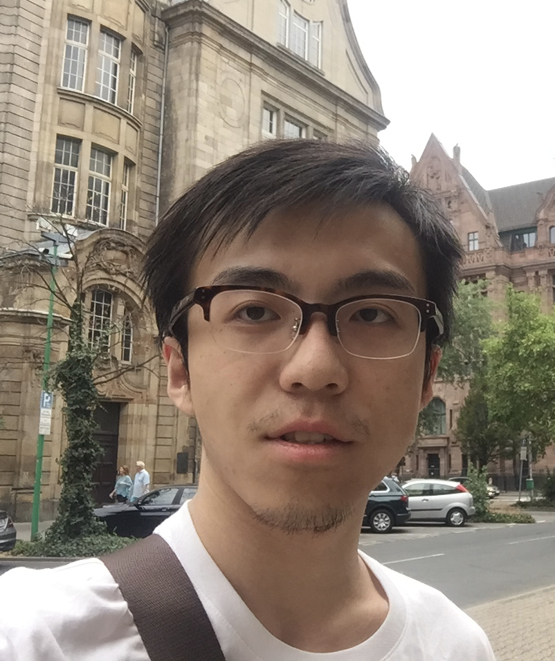 Selfie headshot of PhD student Xinchi Yu, standing on the street in some German city, recognizable as German from the license plates and roadsigns