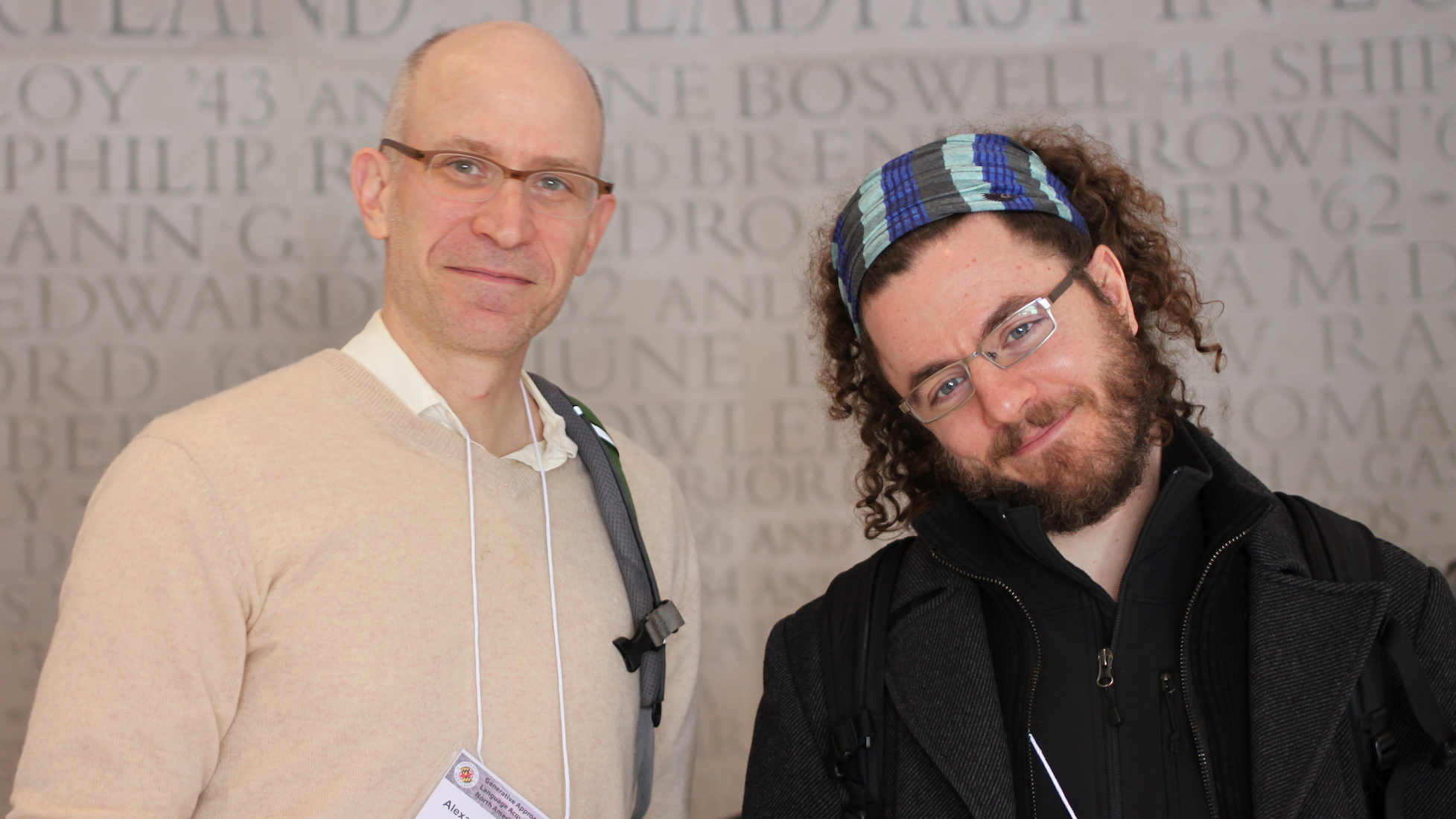 Professors Alexander Williams and Omer Preminger standing together, smiling at the camera