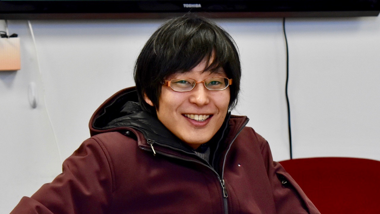 PhD student Hisao Kurokami smiling after the defense of his qualifying paper.