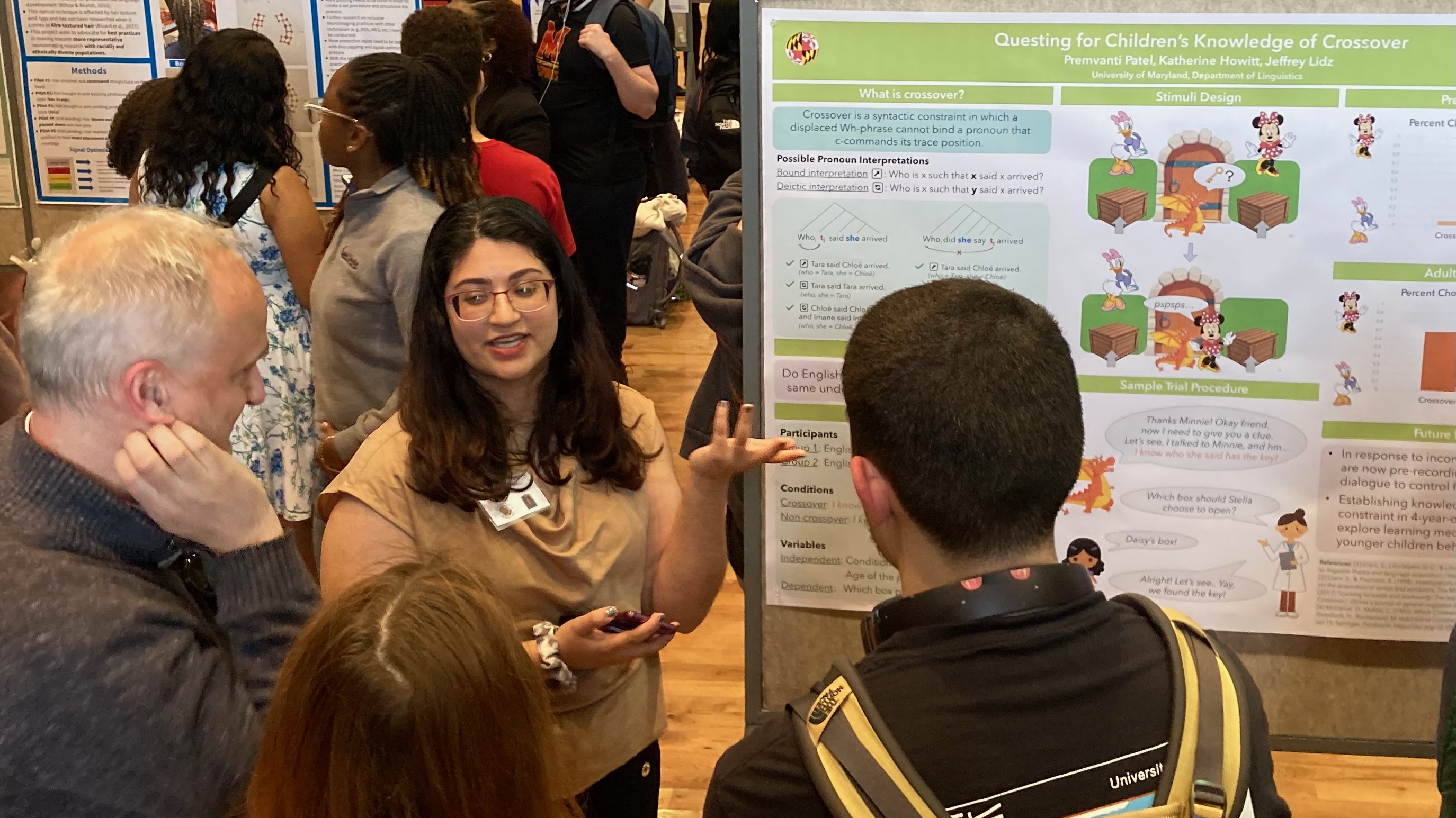 A young woman presenting a research poster