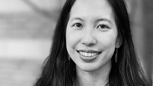 Black and White portrait of a young woman, smiling.