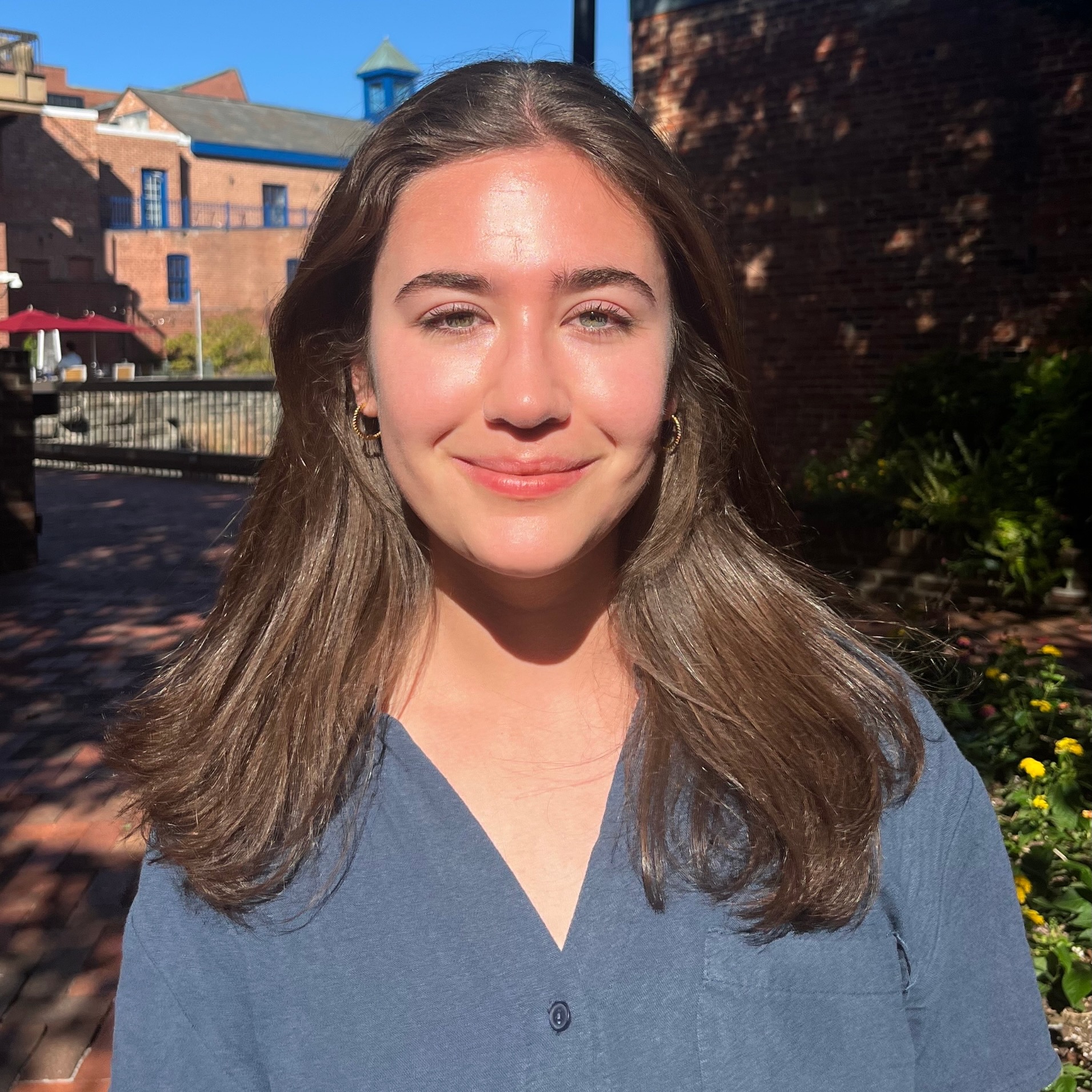 Close portrait of a young woman in the bright sun.